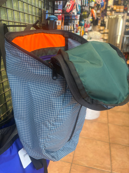 Blue and white Jagged Edge Ajax Pack hanging in Jagged Edge Mountain Gear